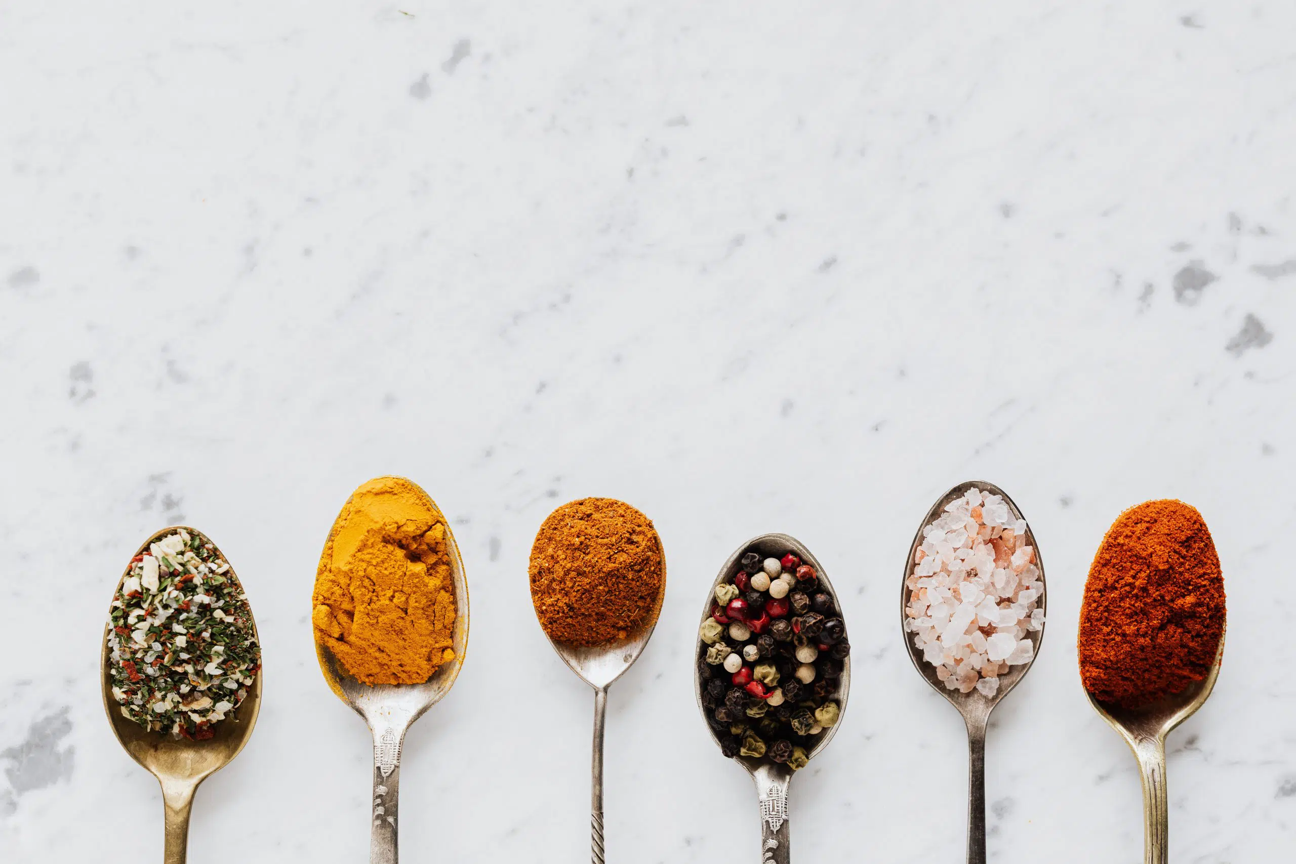 Various spices on spoon